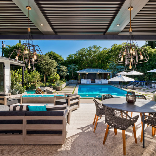 residential outdoor living area by a pool